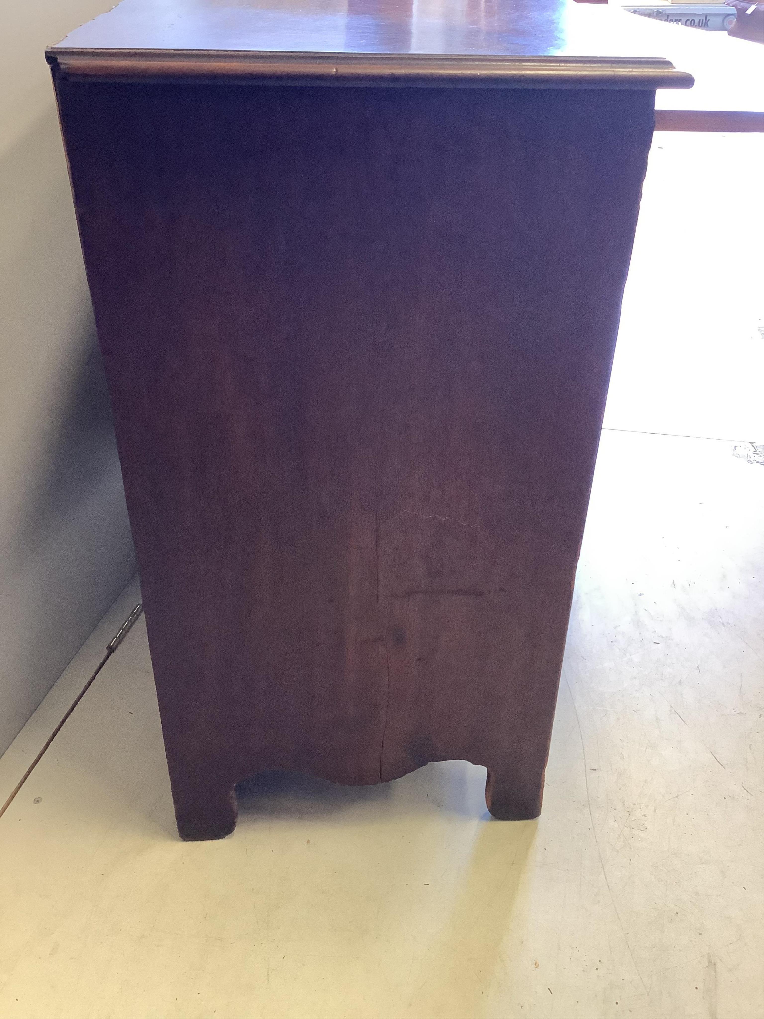 A George III mahogany serpentine chest with brushing slide, width 95cm, depth 52cm, height 91cm